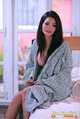 Seated in robe long hair