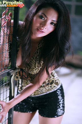 Busty Pim Pimpilai strips on bench and uses toy on shaved pussy
