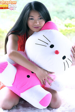 Busty Patty Oraphan strips orange dress and plays with dildo