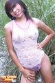 Standing with hand on hip wearing sleepwear