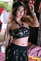 Wearing crop top in skirt arm raised