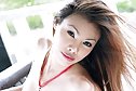 Beauty May Supha strips red top on lounger baring big breasts