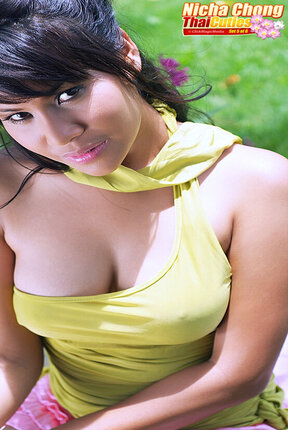 Breasty Nicha Chong strips in garden and spreads her legs