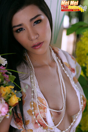 Busty beauty Mei Mei strips dress and plays with vibrator