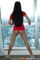 Standing before window legs spread dress up over her panties long hair down her back