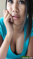 Bee propping her face up with her hand showing cleavage