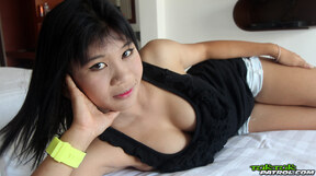 Busty Jang strips on bed and gets fucked and creampied